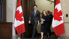 Justin Trudeau and Chrystia Freeland hold copies of the federal budget in Ottawa on April 16.