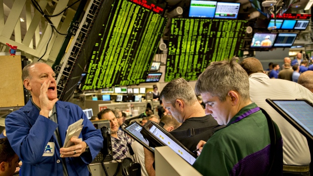 Traders work in the S&P 500 options pit at Cboe Global Markets Inc. in Chicago, Illinois, U.S., on Friday, Dec. 29, 2017. U.S. stocks slipped in thin trading on the final market day of 2017, while the dollars slump continued as the euro headed for its best annual performance in 14 years. The S&P 500 Index turned lower in trading 45 percent below the 30-day average, leaving its gain this year just under 20 percent, the most since 2013. 