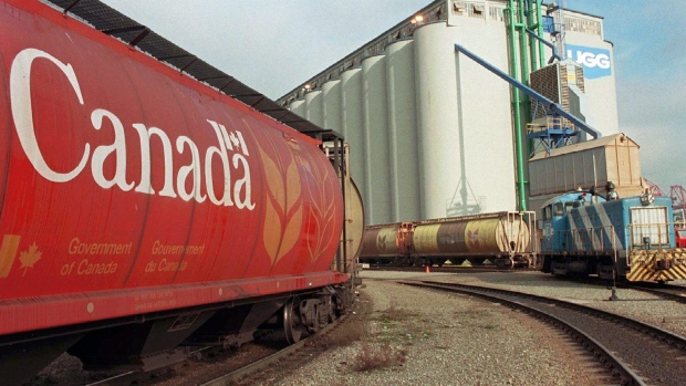 Railroad trains carrying grain in grain cars for export