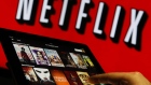 A man scrolls through a selection of viewing choices on the Netflix Inc. app. 
