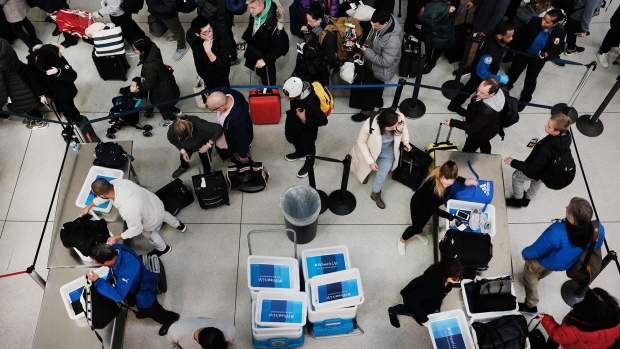 A Transportation Security Administration (TSA) agent works at a check-point inside O'Hare International Airport (ORD) in Chicago. 