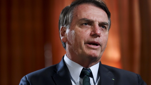 Jair Bolsonaro, Brazil's president, speaks during a Bloomberg Television interview on day two of the World Economic Forum (WEF) in Davos, Switzerland, on Wednesday, Jan. 23, 2019. World leaders, influential executives, bankers and policy makers attend the 49th annual meeting of the World Economic Forum in Davos from Jan. 22 - 25. Photographer: Simon Dawson/Bloomberg