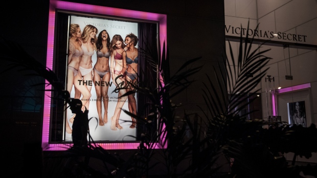 An illuminated advertisement is displayed outside a Victoria's Secret Stores LLC store, a subsidiary of L Brands Inc., at night in Chicago. 
