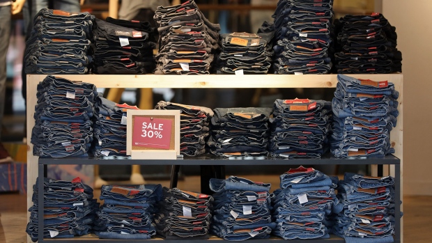 Piles of jeans sit displayed for sale inside a Levi Strauss & Co. fashion store in London. 