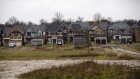 Homes stand beyond an undeveloped plot of land in East Gwillimbury, Ontario, Canada, on Friday, Nov. 2, 2018. STCA Canada is scheduled to release new housing price figures on Dec. 13. 