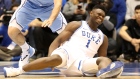 Zion Williamson reacts after falling as his shoe breaks in the first half of a game in Durham, North Carolina on Feb. 20, 2019. 