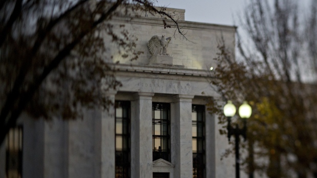 (EDITORS NOTE: Image was created using a variable planed lens.) The Marriner S. Eccles Federal Reserve building stands in Washington, D.C., U.S., on Friday, Nov. 18, 2016. Federal Reserve Chair Janet Yellen told lawmakers on Thursday that she intends to stay in the job until her term expires in January 2018 while extolling the virtues of the Fed's independence from political interference. 
