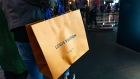 A shopper carries a LVMH Moet Hennessy Louis Vuitton SE branded shopping bag on Canton Road in the Tsim Sha Tsui district of Hong Kong, China, on Sunday, Feb. 3, 2019. The week-long Lunar New Year holiday, starting Feb. 4, will provide the next litmus test of the resilience of the Chinese shopper. The seven-day period sees hundreds of millions of people travel within the country to see relatives, fly overseas to takevacations - and open their wallets to buy gifts. Photographer: Anthony Kwan/Bloomberg