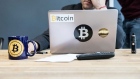 FILE: An employee uses a laptop computer branded with bitcoin logos inside the offices of La Maison du Bitcoin bank in Paris, France, on Thursday, Nov. 23, 2017. The great cryptocurrency crash of 2018 is heading for its worst week yet. Bitcoin sank toward $4,000 and most of its peers tumbled on Friday, extending the Bloomberg Galaxy Crypto Indexs weekly decline to 25 percent. Thats the worst five-day stretch since crypto-mania peaked in early January. 