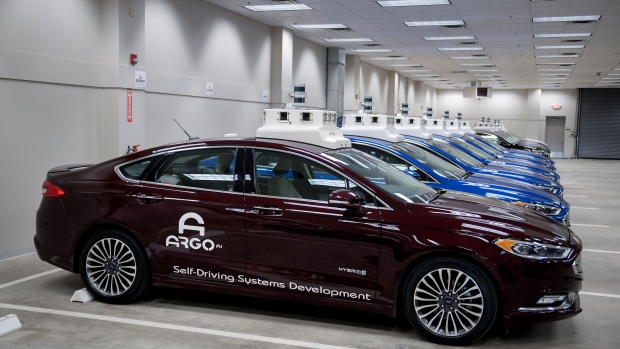 Argo AI modified Ford Motor Co. Fusion autonomous vehicle sit parked in a garage at the company's headquarters in Pittsburgh, Pennsylvania, U.S., on Thursday, Aug. 16, 2018. 