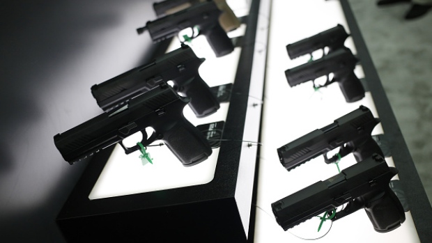 SIG P320 handguns are displayed at the SIG Sauer GmbH booth on the exhibit floor during the National Rifle Association (NRA) annual meeting in Louisville, Kentucky, U.S., on Friday, May 20, 2016. The nation's largest gun lobby, the NRA has been a political force in elections since at least 1994, turning out its supporters for candidates who back expanding access to guns. 