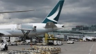 A Cathay Pacific Airlines Ltd. plane sits at a gate at Toronto Pearson International Airport (YYZ) in Toronto, Ontario, Canada, on Monday, July 22, 2019. In 2018, 49.5 million passengers traveled through Pearson on 473,000 flights. 