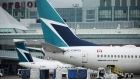A Boeing Co. 737-800 WestJet Airlines plane sits at a gate at Toronto Pearson International Airport. 