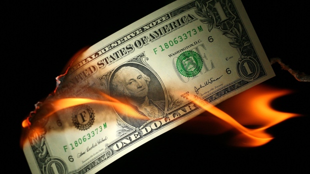 GETTY IMAGES - In this photo illustration, an America one USD note burns, October 24, 2008, Manchest
