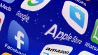 In this photo illustration, logos of the Google, Apple, Facebook, and Amazon applications (GAFA) are displayed on the screen of an Apple iPhone on May 31, 2018 in Paris, France.