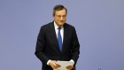 Mario Draghi, president of the European Central Bank (ECB), collects his documents as he departs fol