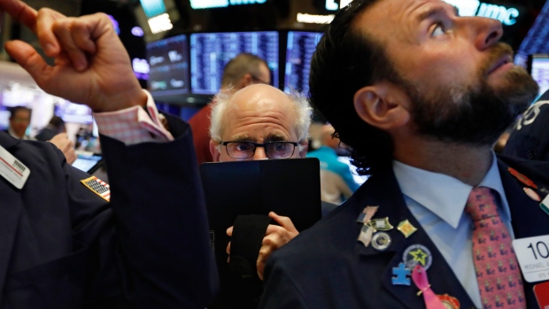 Trader Peter Tuchman, center, works on the floor of the New York Stock Exchange, Nov. 4, 2019.