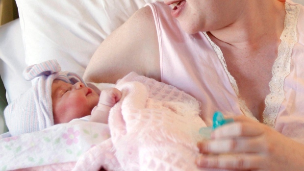 A mother holds her newborn baby at a hospital in Corpus Christi, Texas, Friday, Nov. 11, 2011. 
