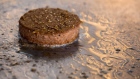 A seasoned Beyond Meat Inc. plant-based burger patty cooks on the grill. Photographer: Andrey Rudakov/Bloomberg
    