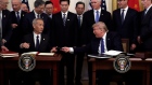 President Donald Trump signs a trade agreement with Chinese Vice Premier Liu He