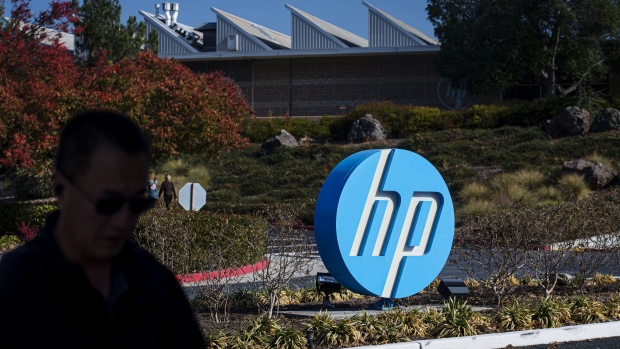 A pedestrian walks past HP Inc. headquarters in Palo Alto, California. Bloomberg/David Paul Morris