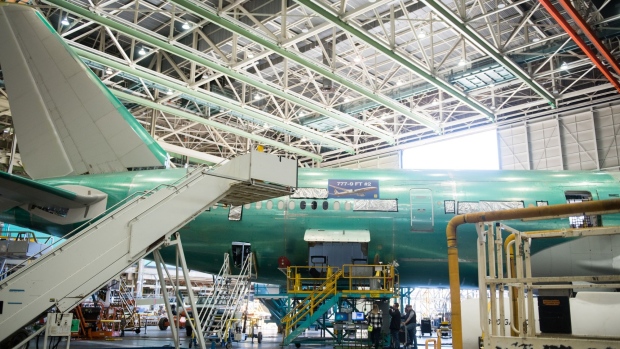 A Boeing Co. 777X folding wingtip during assembly in Everett.  Photographer: Chona Kasinger/Bloomberg