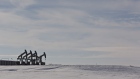 Pumpjacks operate on oil wells in the Bakken Formation outside Williston, North Dakota, U.S., on Friday, March 9, 2018. 