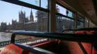 The Houses of Parliament stand in this view from inside a bus in London on April 22. Photographer: Hollie Adams/Bloomberg