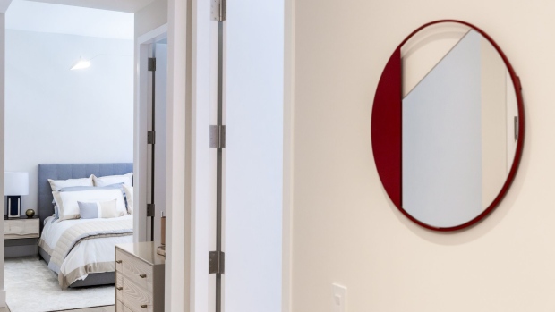 A mirror is displayed outside the bedroom of an apartment unit in the AvalonBay Communities Inc. Park Loggia condominium at 15 West 61 Street in New York, U.S., on Wednesday, May 15, 2019. AvalonBay Communities real estate investment trust acquired the site for the Park Loggia for $300 million, near the peak of Manhattan's high-end sales frenzy, with plans for luxury rentals and, perhaps, some condos. Since then, the borough has become saturated with both and AvalonBay decided the more-lucrative option was to go all-condo. Photographer: Mark Abramson/Bloomberg