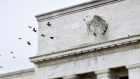 Birds fly past the Marriner S. Eccles Federal Reserve Board building in Washington, D.C. Photographer: Joshua Roberts/Bloomberg