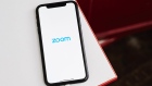 The logo for the Zoom Video Communications Inc. application is displayed on an Apple Inc. iPhone in an arranged photograph taken in the Brooklyn borough of New York, U.S., on Friday, April 10, 2020. Zoom's shares have soared in 2020 as the popularity of its video conferencing service has grown during a time of widespread lockdowns aimed at stemming the spread of the coronavirus pandemic. Photographer: Gabby Jones/Bloomberg