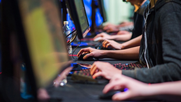 Gamers compete in a Valve Corp. Counter-Strike: Global Offensive (CS:GO) esports tournament at the Gaming Stadium in Vancouver, British Columbia, Canada, on Sunday, July 14, 2019. Esports revenue, consisting of merchandise, event tickets, sponsorships, advertising, investment from publishers and media rights -- all beyond game sales -- is expected to rise at a 20% average annual rate in 2018-22 to $1.8 billion in 2022, according to Newzoo. Photographer: James MacDonald/Bloomberg