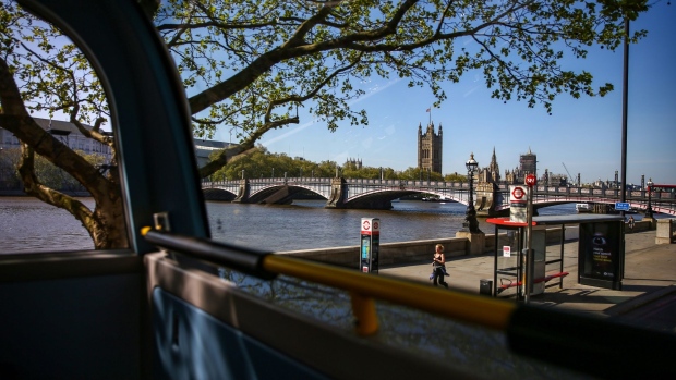 The Houses of Parliament stand in this view from inside a bus in London. Photographer: Hollie Adams/Bloomberg