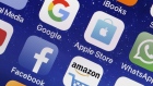 PARIS, FRANCE - MAY 31: In this photo illustration, logos of the Google, Apple, Facebook, and Amazon applications (GAFA) are displayed on the screen of an Apple iPhone on May 31, 2018 in Paris, France. The acronym GAFA refers to the four most powerful companies in the world of the internet: Google, Apple, Facebook and Amazon. The European Union has decided to better tax the giants of the internet with Brussels proposing to tax 3% of income generated by the data of users of Internet companies. This new tax would bring in 5 billion euros a year in the European Union. (Photo by Chesnot/Getty Images) Photographer: Chesnot/Getty Images Europe