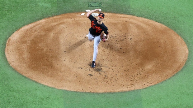 ARLINGTON, TEXAS - OCTOBER 10: Dean Kremer #64 of the Baltimore Orioles pitches against the Texas Rangers during the first inning in Game Three of the Division Series at Globe Life Field on October 10, 2023 in Arlington, Texas. (Photo by Richard Rodriguez/Getty Images)
