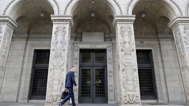 <p>A visitor arrives at the Swiss National Bank in Zurich.</p>
