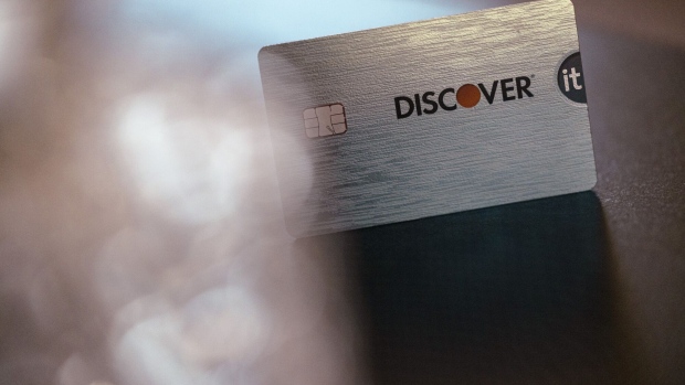 A Discover credit card arranged in Germantown, New York, US, on Tuesday, Feb. 20, 2024. Capital One Financial Corp. agreed to buy Discover Financial Services in a $35 billion all-stock deal to create the largest US credit card company by loan volume, giving the combined entity a stronger foothold to compete with Wall Streets behemoths. Photographer: Angus Mordant/Bloomberg
