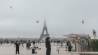 <p>Visitors at the viewpoint to the Eiffel tower in Trocadero Square in central Paris.</p>