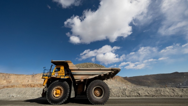 A dump truck carrying raw ore at the open pit mine at the Erdenet Mining Corp. copper mine in Erdenet, Mongolia, on Wednesday, March 15, 2023. Erdenet, the country's second-biggest copper mine, has been producing since 1978 when it was set up with support from the Soviet Union. Photographer: SeongJoon Cho/Bloomberg