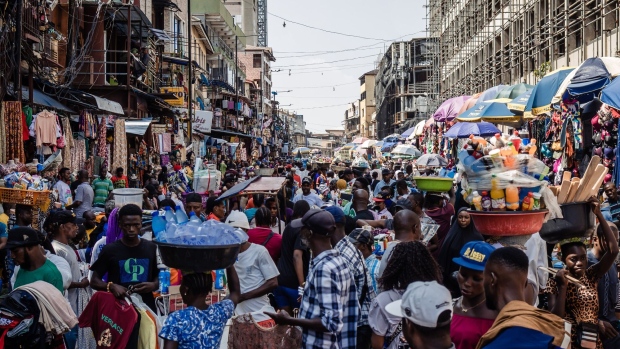 Shoppers and traders in a congested street market in Lagos.