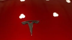 A Tesla logo on the front of a Model Y during the Canadian International AutoShow in Toronto, Ontario, Canada, on Friday, Feb. 16, 2024. Photographer: Cole Burston/Bloomberg