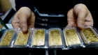 Gold bars on display in Hanoi. Photographer: Hoang Dinh Nam/AFP/Getty Images