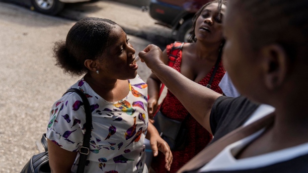 A woman receives an oral cholera vaccine in Port-au-Prince in Haiti. Photographer: Richard Pierrin/AFP/Getty Images
