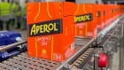 Aperol bottles in line to be labeled and dispatched.