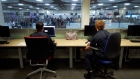 <p>Border Force officers work in the watch room at Terminal 5 at London Heathrow Airport.</p>