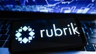POLAND - 2024/02/04: In this photo illustration a Rubrik logo is displayed on a smartphone with stock market percentages in the background. (Photo Illustration by Omar Marques/SOPA Images/LightRocket via Getty Images)