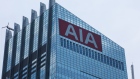 The AIA Group Ltd. logo is displayed on a screen atop the AIA Central building in Hong Kong, China, on Friday, July 28, 2017. AIA, the world's second-biggest life insurer by market value, reported its fastest first-half new business value growth as a public company. Photographer: Billy H.C. Kwok/Bloomberg