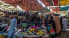 Shoppers browse clothing at a market in Karachi.
