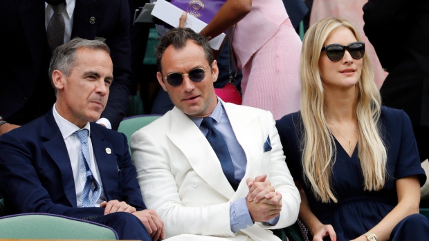 Mark Carney, Jude Law and Phillipa Coan at Wimbledon