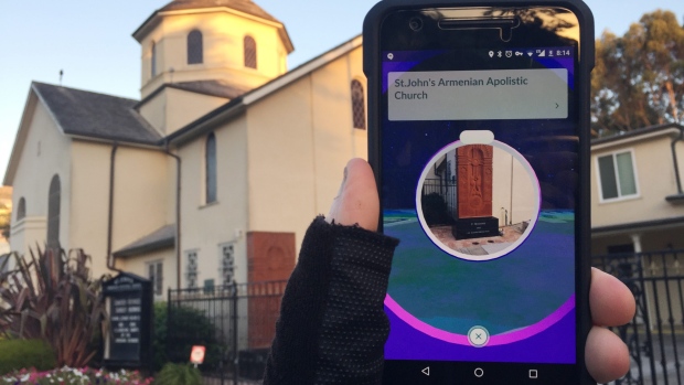 "Pokemon Go" on a smartphone in front of a church, in San Francisco